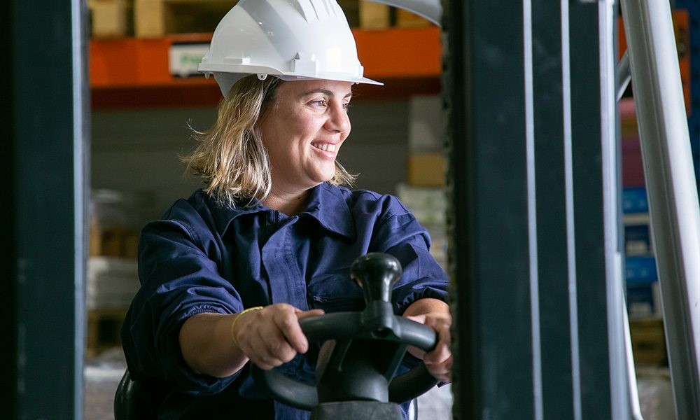 Happy Woman on Forklift
