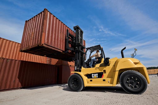 Large CAT forklift with a shipping container