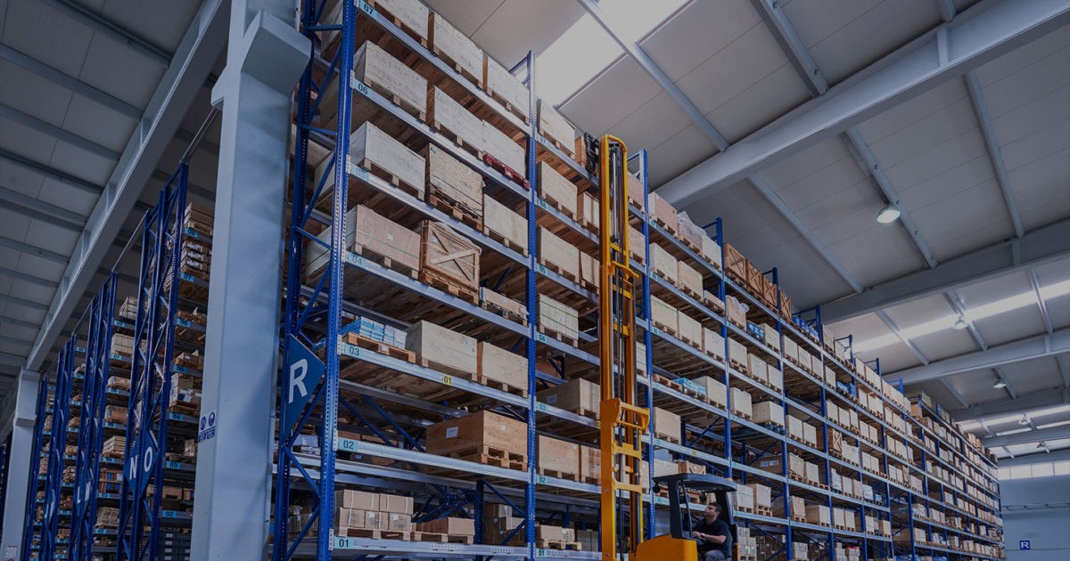 Warehouse racking with narrow aisle forklift