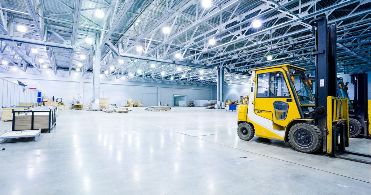 Yellow forklift in expansive warehouse