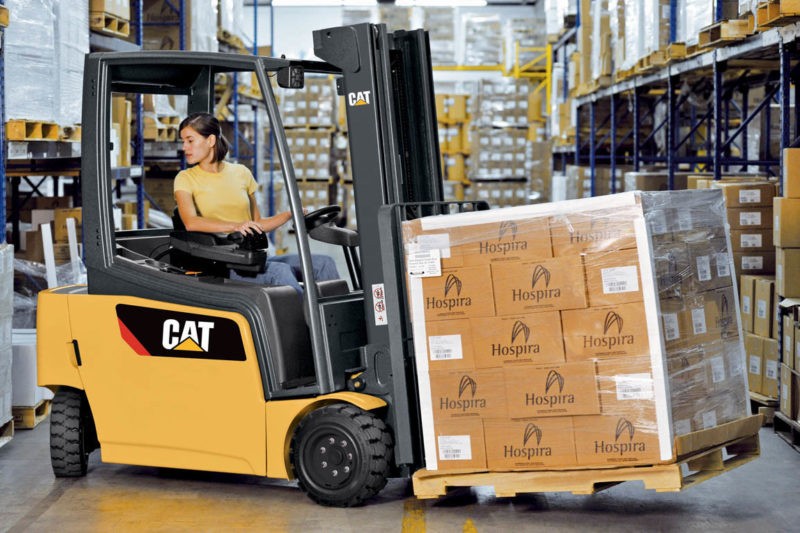 Woman on a CAT forklift