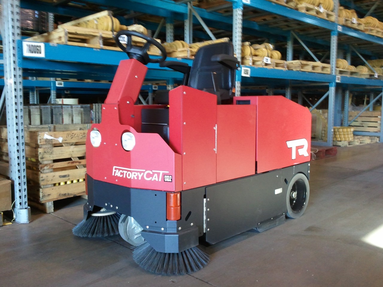 Factory Cat floor cleaner in warehouse