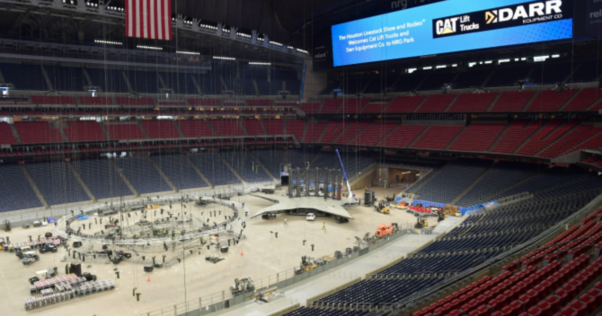 Houston Livestock Show and Rodeo stadium view with forklifts working
